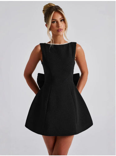 Elegant Solid Color Mini Dress with Bow Detail and Pearl Accents for Stylish Occasions