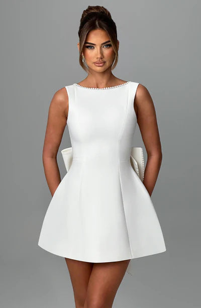 Solid Color Mini Dress in white featuring a sleek design and elegant neckline