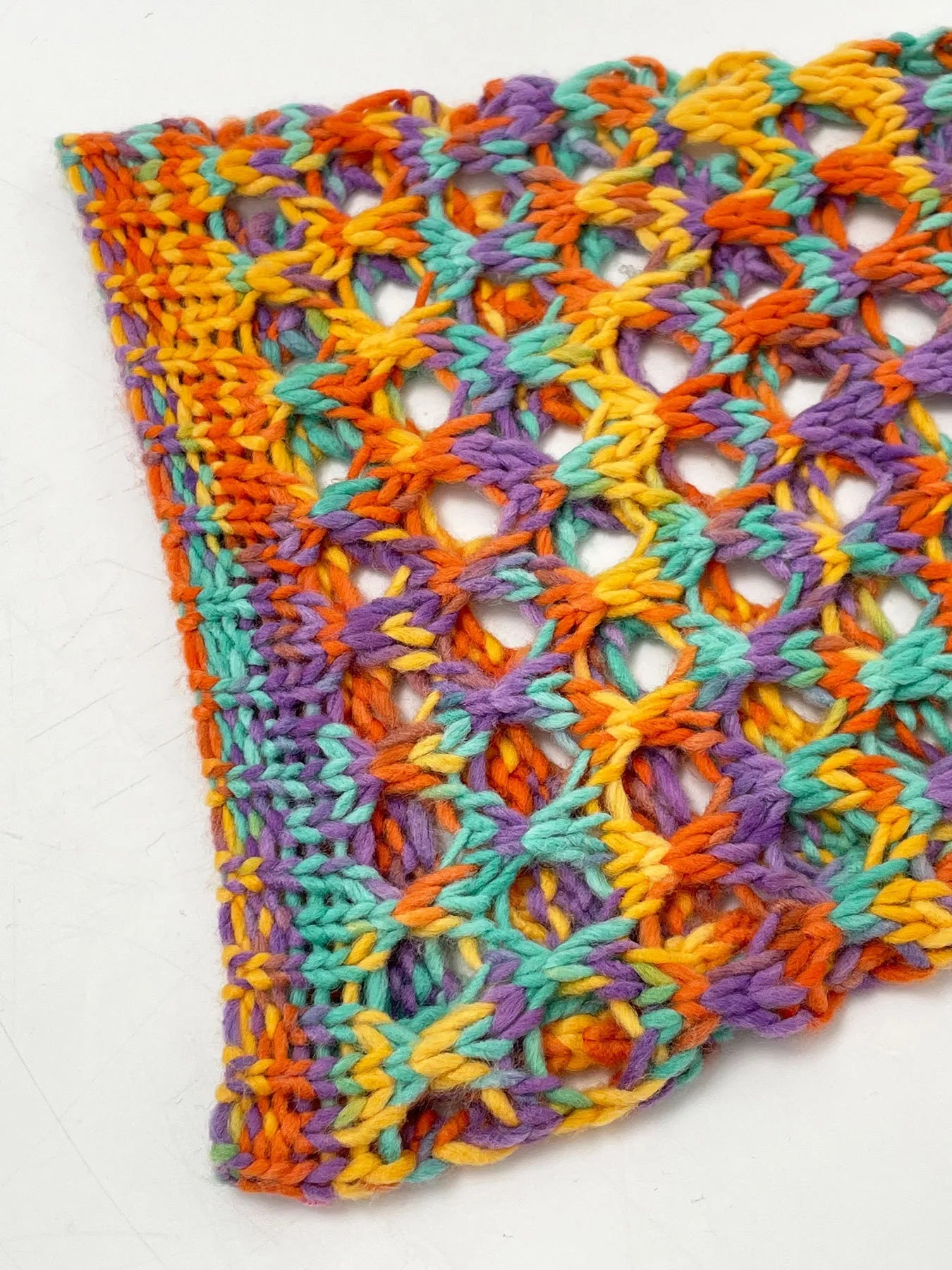 Trendsi Hollow Out Cropped Sweater multicolor open knit crochet hem close up lightweight summer layering
