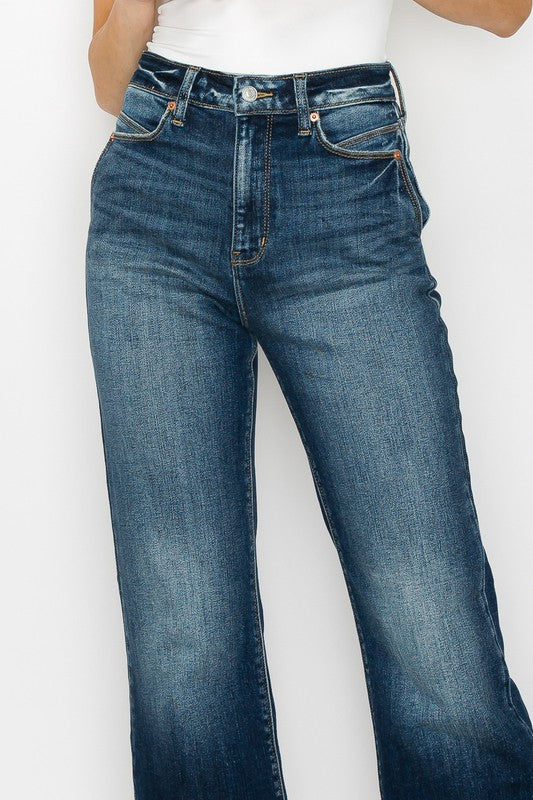 Artemis Vintage High Rise Holly Flare Jeans dark wash front view on model showing high waist and subtle flare