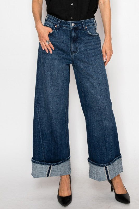 Artemis Vintage dark blue cuffed denim high rise wide leg jeans for women styled with black top and heels