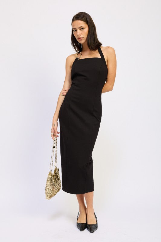 Emory Park black open back midi dress with halter neckline fitted silhouette and chain shoulder bag