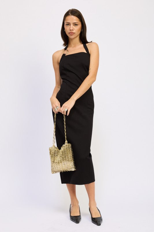 Emory Park black open back midi dress with halter neckline fitted silhouette model holding gold bag
