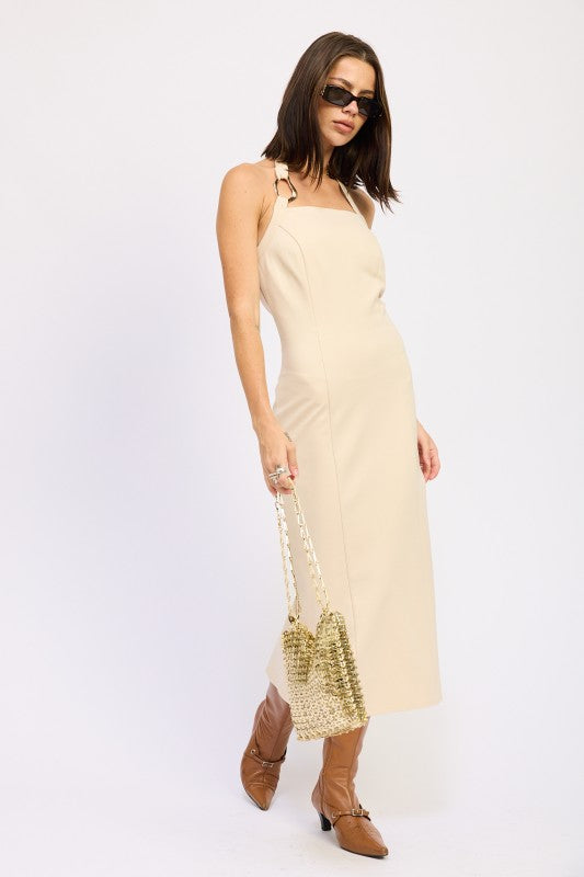 Emory Park beige open back midi dress with tie shoulder straps and square neckline styled with woven bag and brown boots