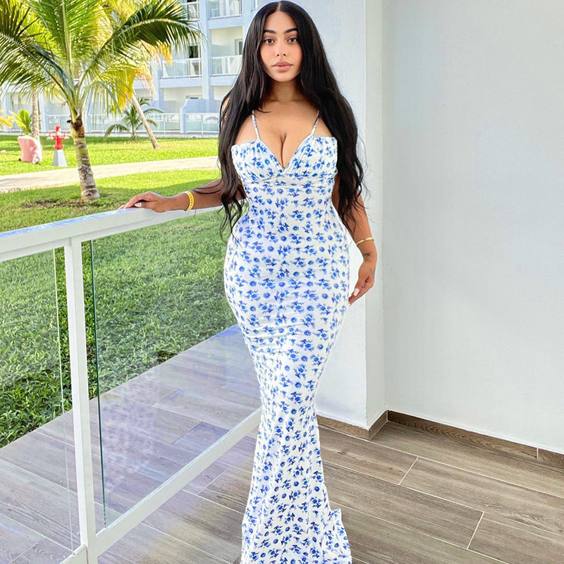 Trendsi floral print summer maxi dress worn by woman with long black hair outdoors by railing