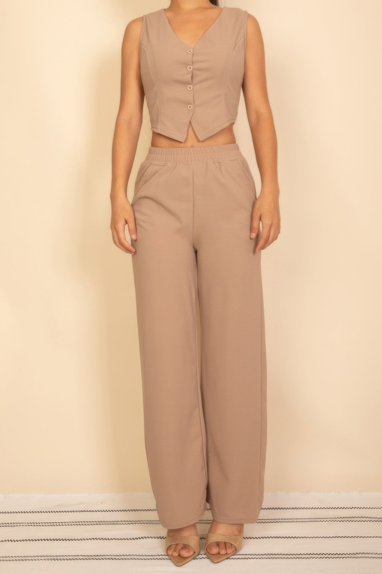 Stylish model wearing a Tailored Button Vest paired with matching wide-leg pants for a chic look