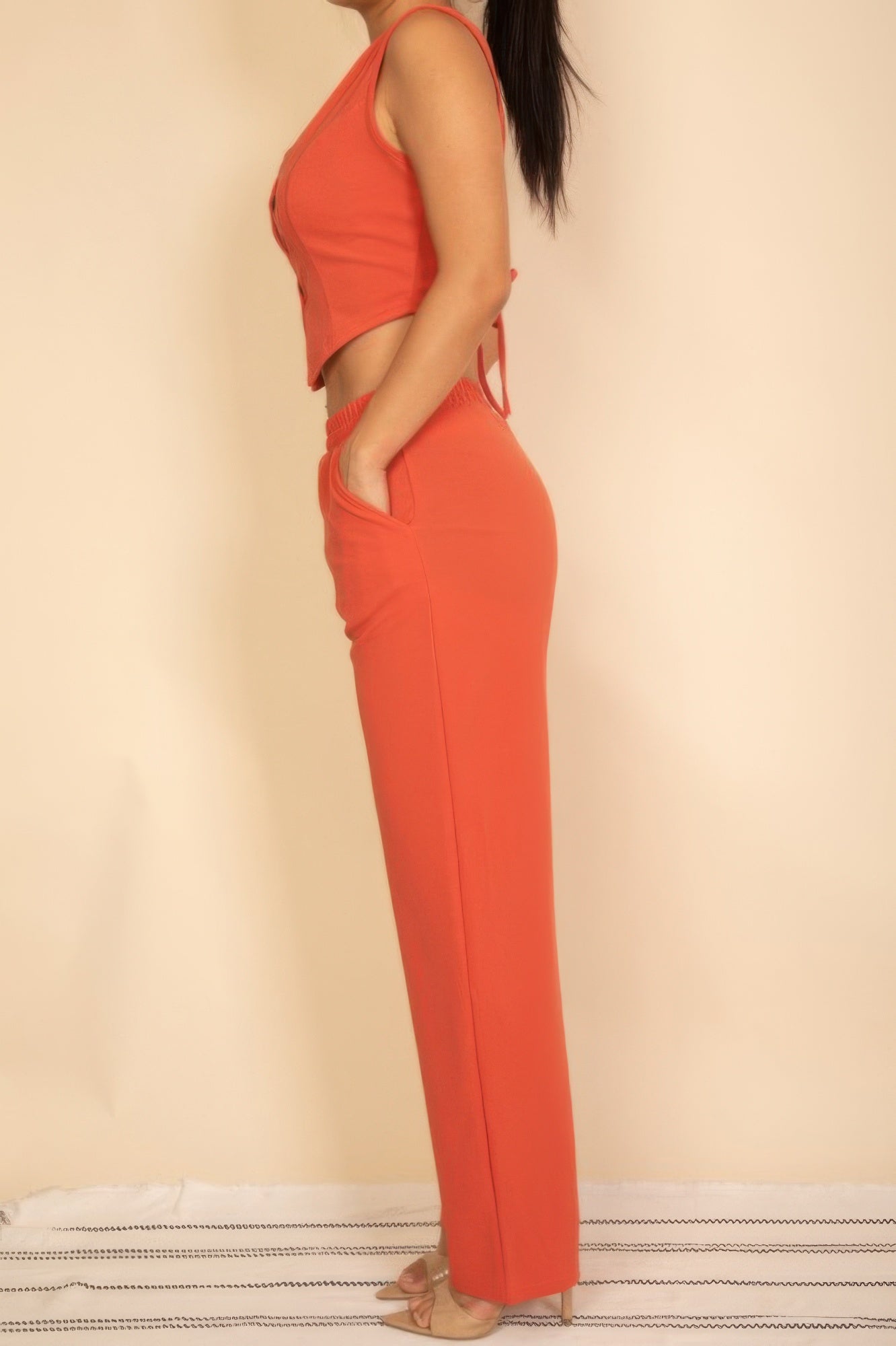Stylish orange Tailored Button Vest paired with matching pants for a chic summer outfit