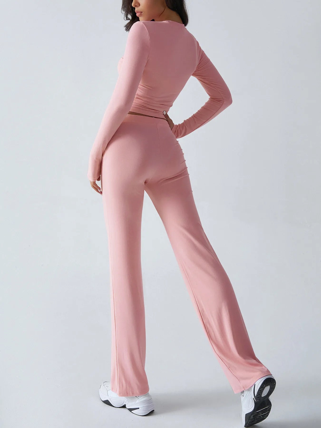 Trendsi Pink Top and Pant Set featuring a fitted long sleeve top and flared pants for a stylish look