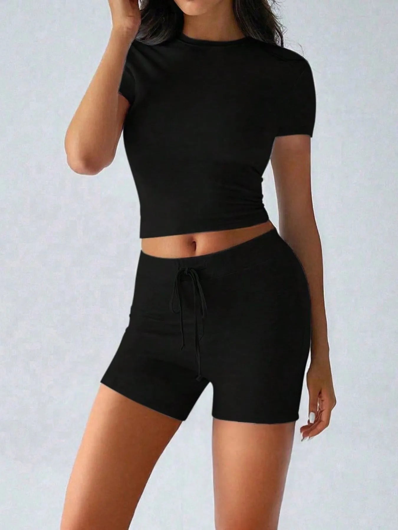 Black casual top with matching shorts for a stylish and comfortable look