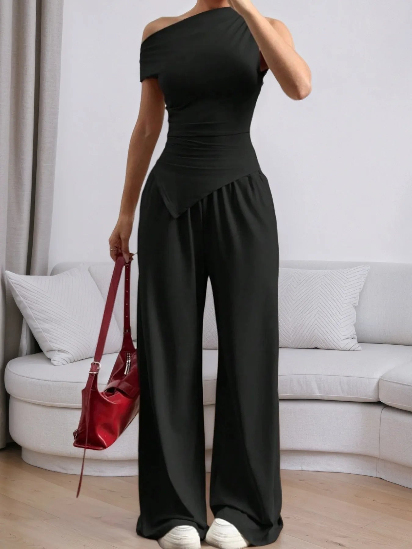 Stylish black top with trendy pants for a chic and modern outfit