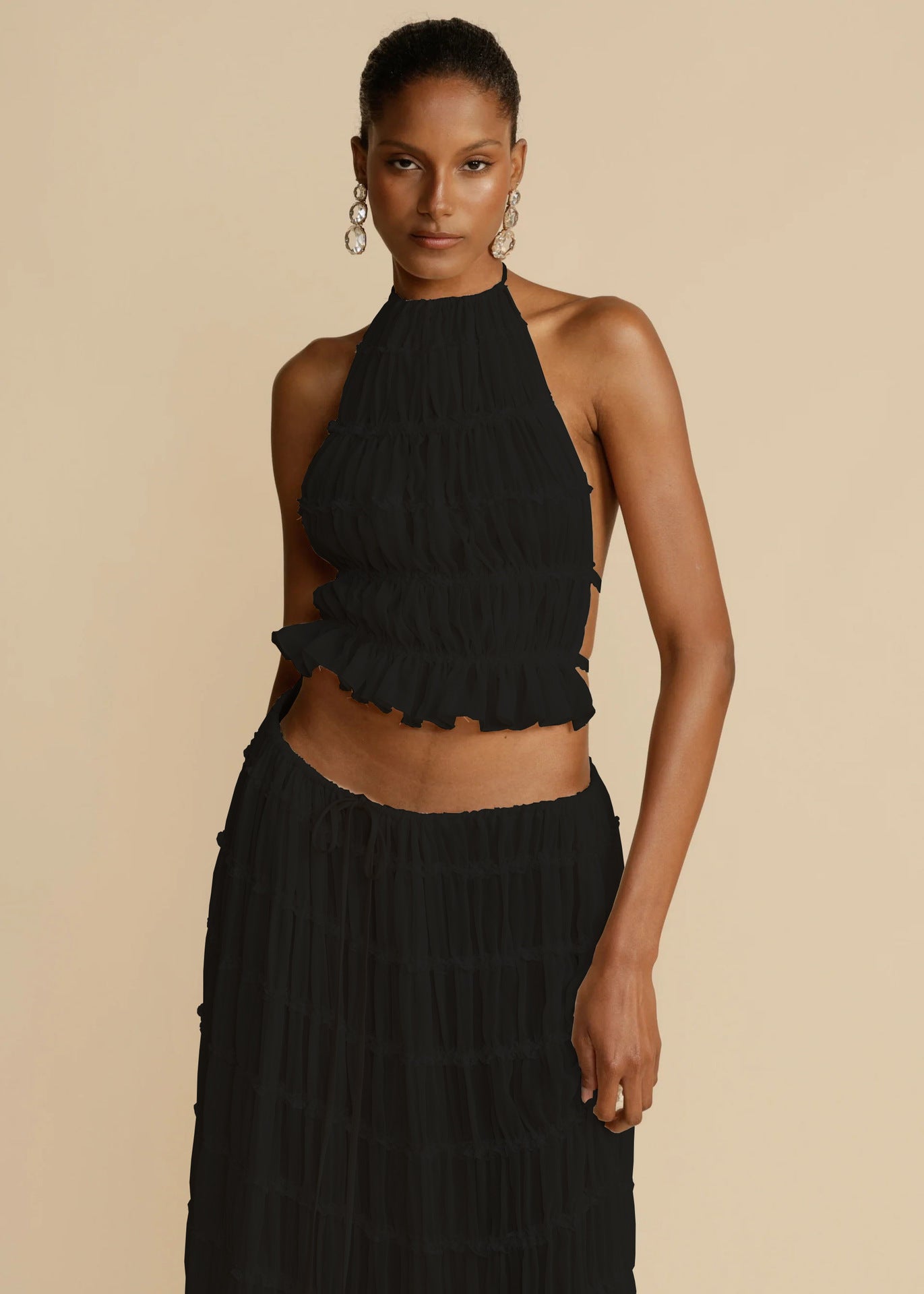 Trendy Halter Top & Maxi Skirt in Black with Ruffle Details for a Stylish Look