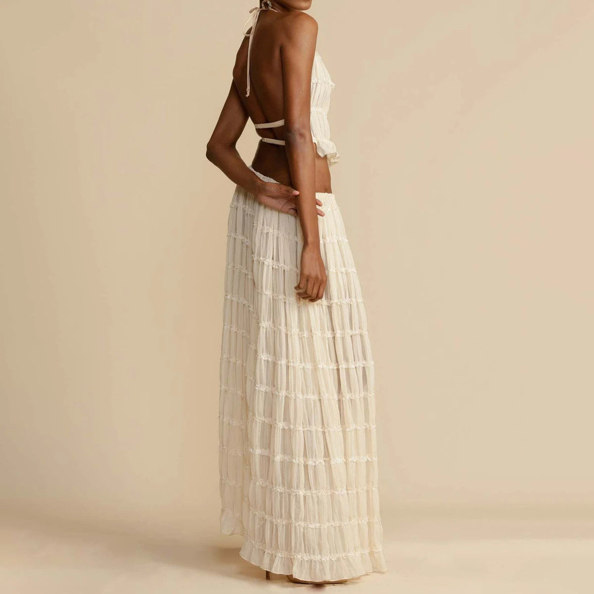 Elegant woman wearing a Trendy Halter Top & Maxi Skirt in a flowing design