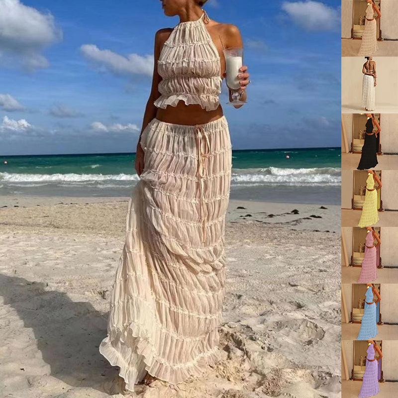 Model wearing a Trendy Halter Top & Maxi Skirt on the beach with ocean backdrop