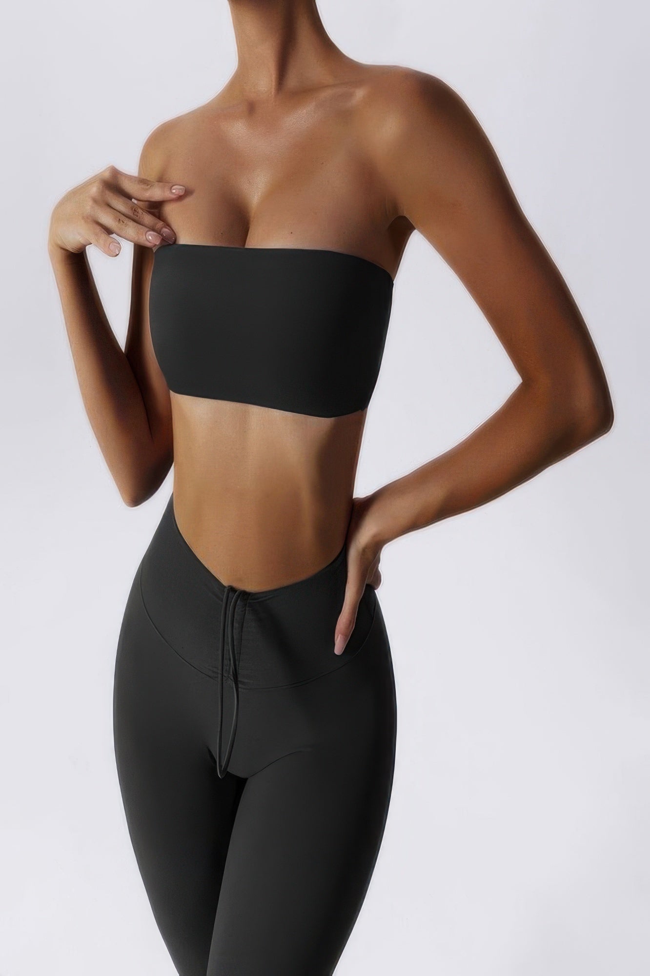 CCWHOLESALECLOTHING model wearing black strapless tube bra for women with high waist leggings