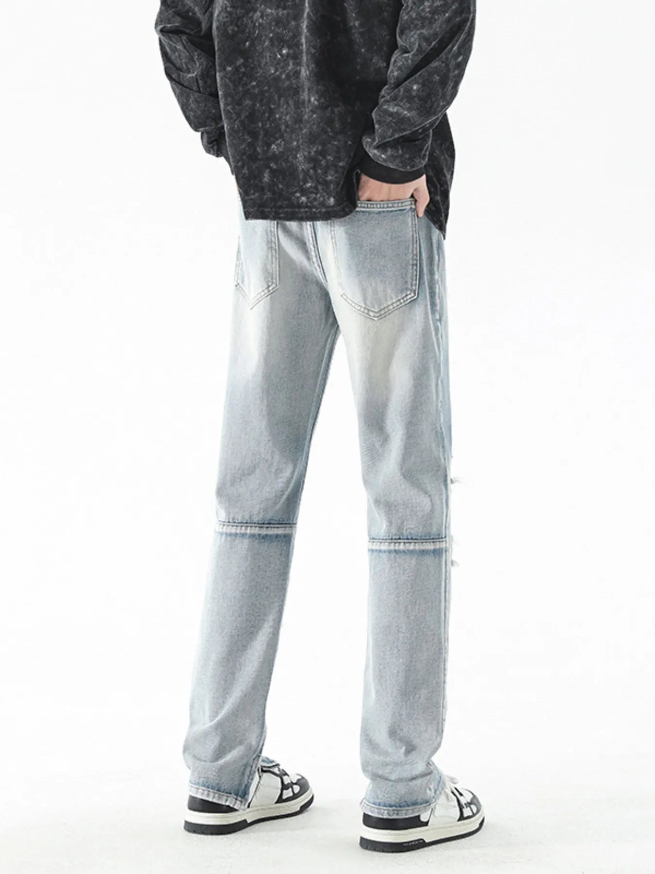 Trendsi men's distressed straight jeans light wash back view with faded whiskering knee seam and sneakers