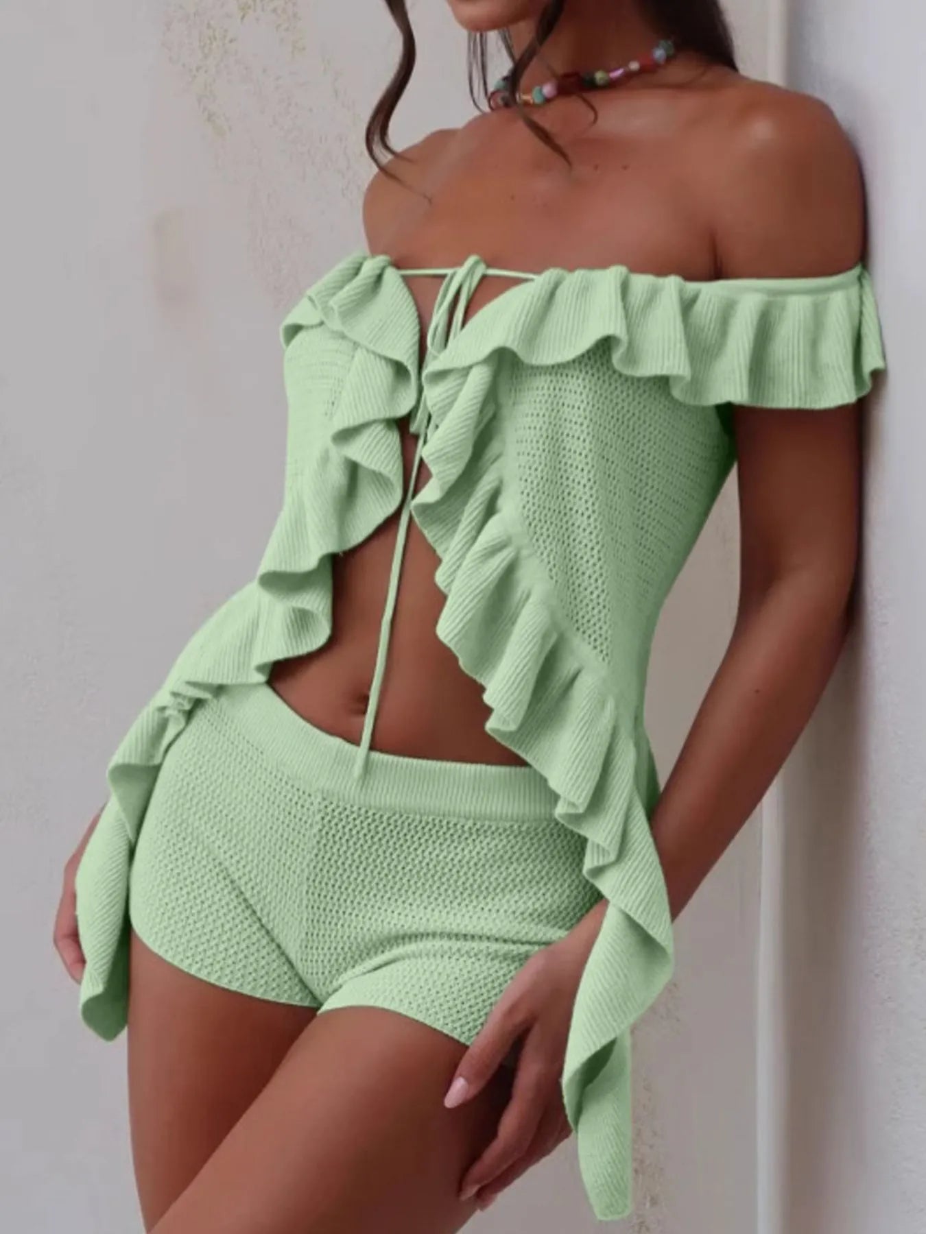 Trendsi off-shoulder ruffle top in light green knit fabric paired with matching shorts