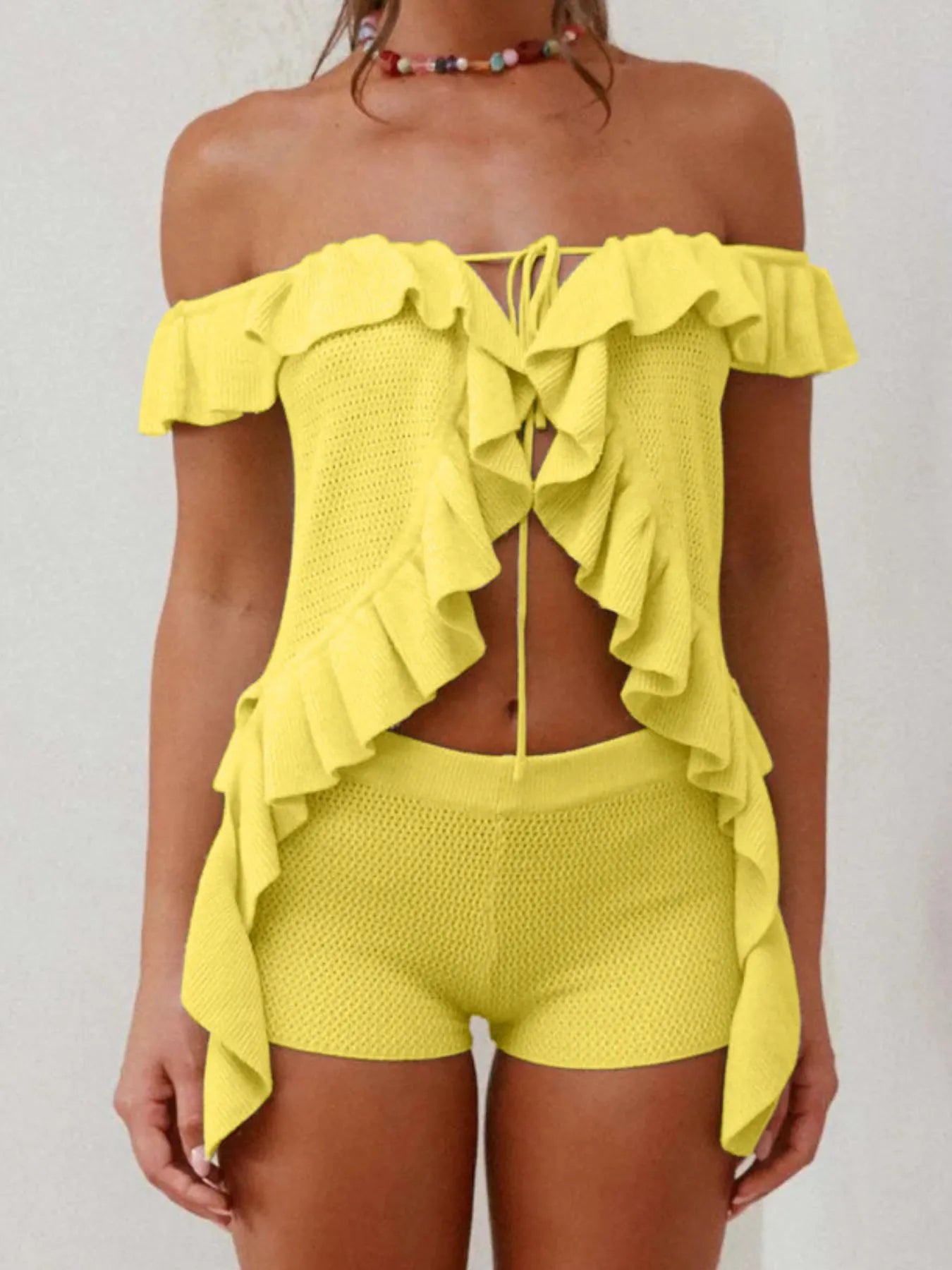 Yellow off-shoulder ruffle top by Trendsi with textured fabric and matching shorts set