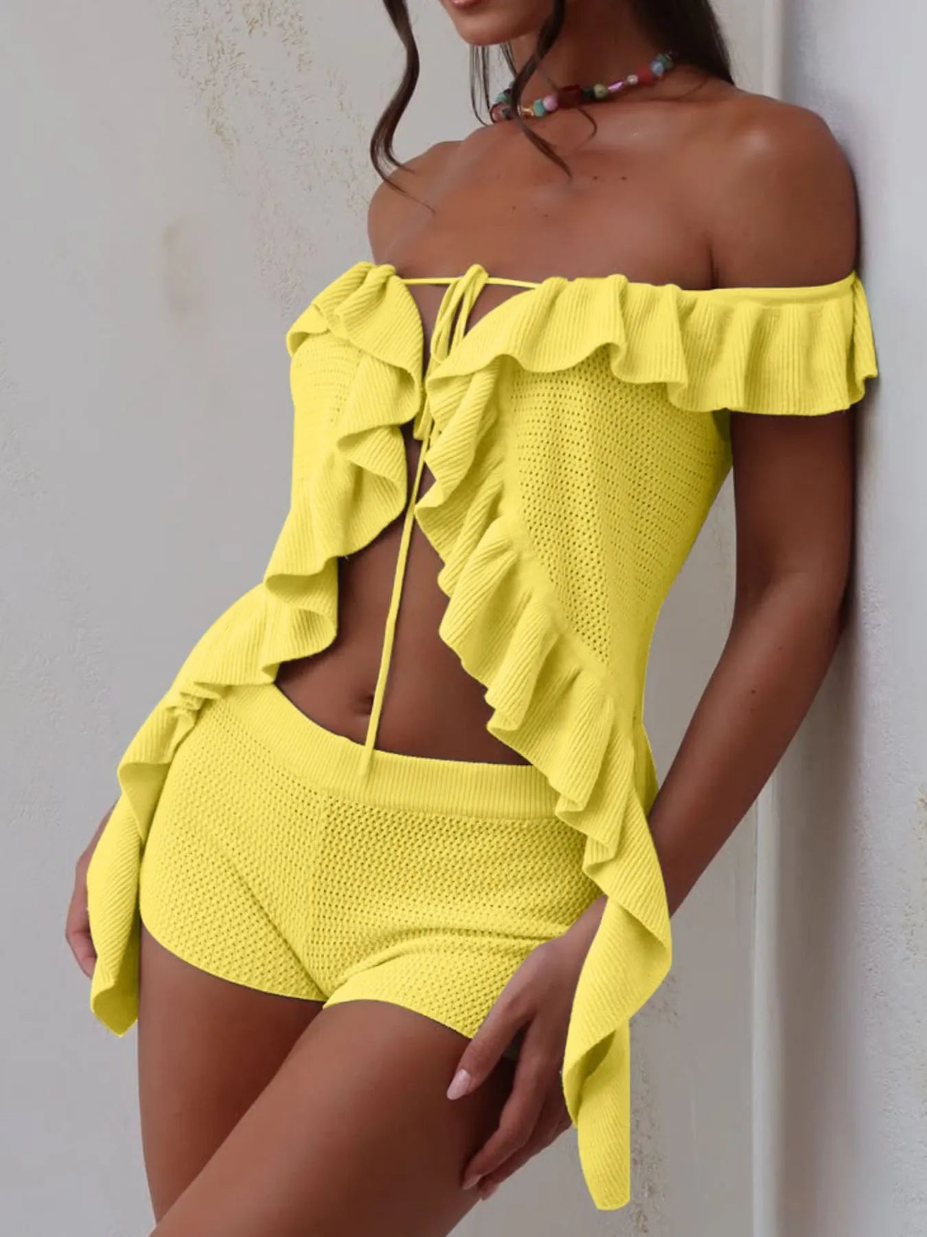 Yellow off-shoulder ruffle top with matching shorts featuring textured fabric from Trendsi