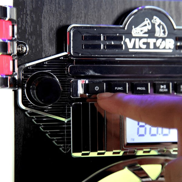 Close-up of hand pressing buttons on Victor Wilshire Bluetooth Jukebox by Jupiter Gear