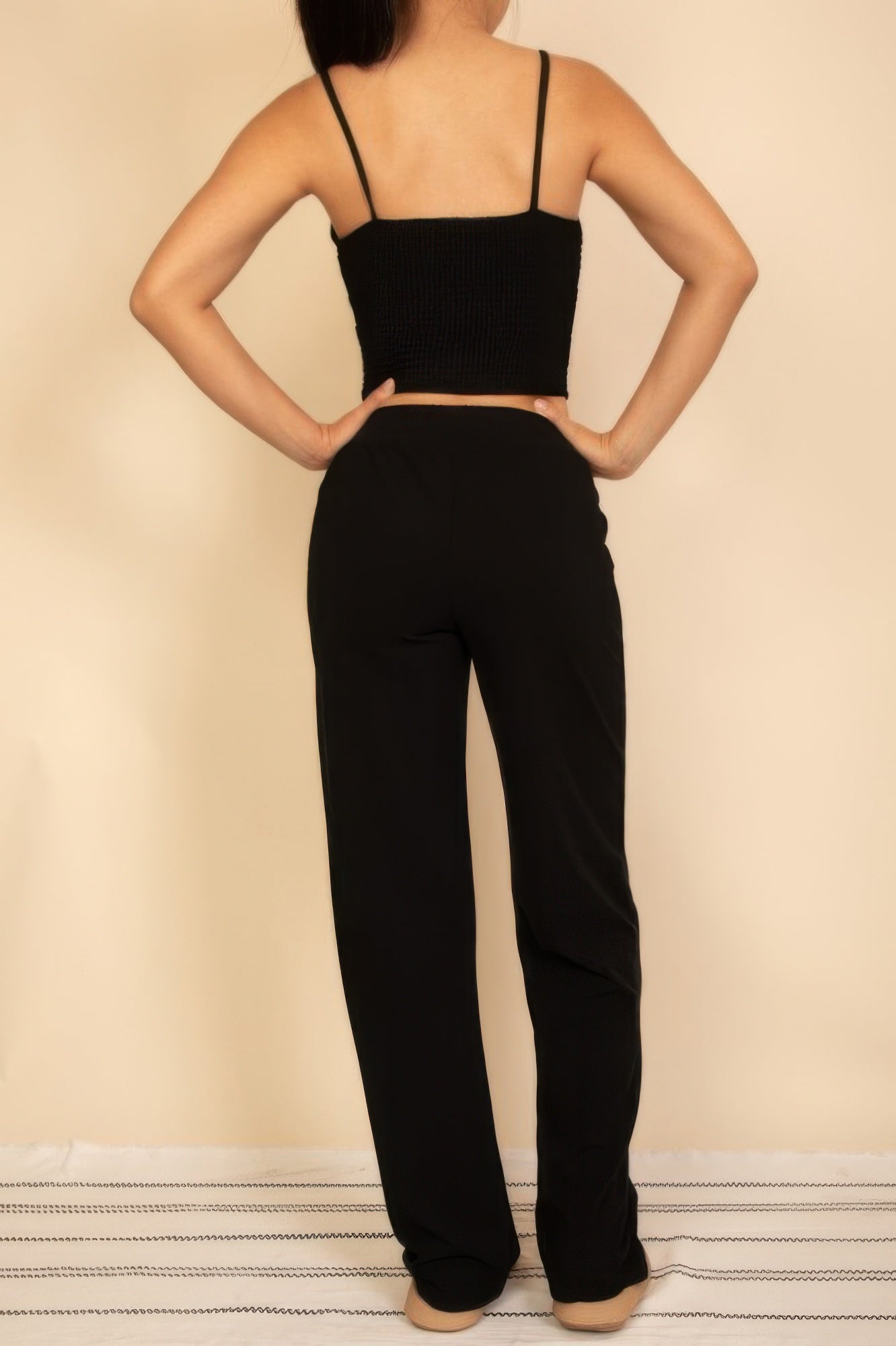 Back view of Wide Leg Pants Set featuring a cropped top and relaxed fit pants in black