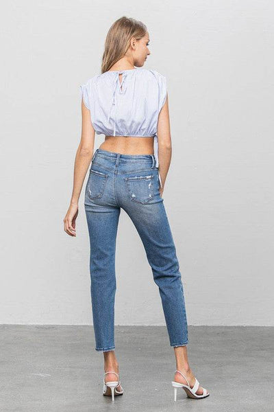 Mid-Rise Slim Girlfriend Jeans with Ripped Details - Fashions Envy