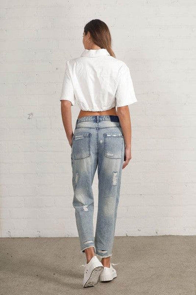 Raw Hem Patched Medium Wash Jeans - Fashions Envy