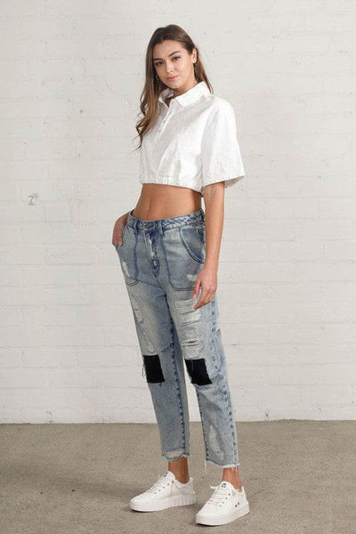 Raw Hem Patched Medium Wash Jeans - Fashions Envy