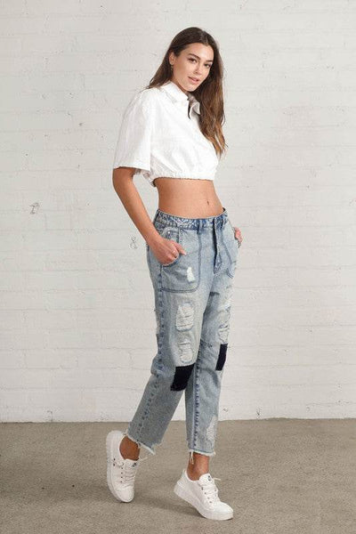 Raw Hem Patched Medium Wash Jeans - Fashions Envy