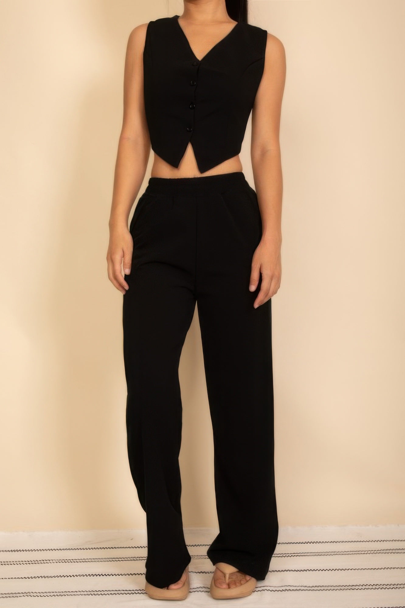 Stylish black Tailored Button Vest paired with matching wide-leg pants for a chic look