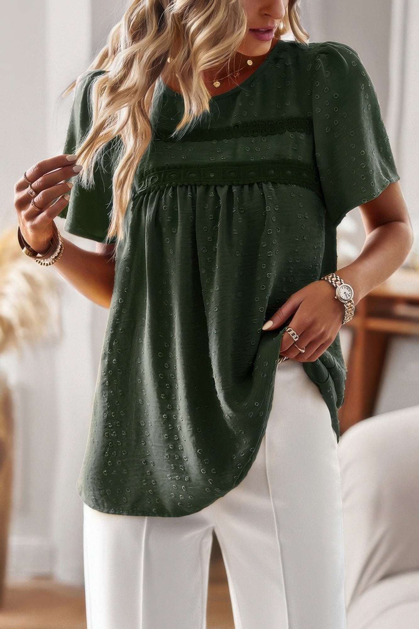 Green textured plus size solid short sleeve top with gathered empire seam and white pants