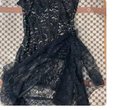 Black lace garment on a patterned surface