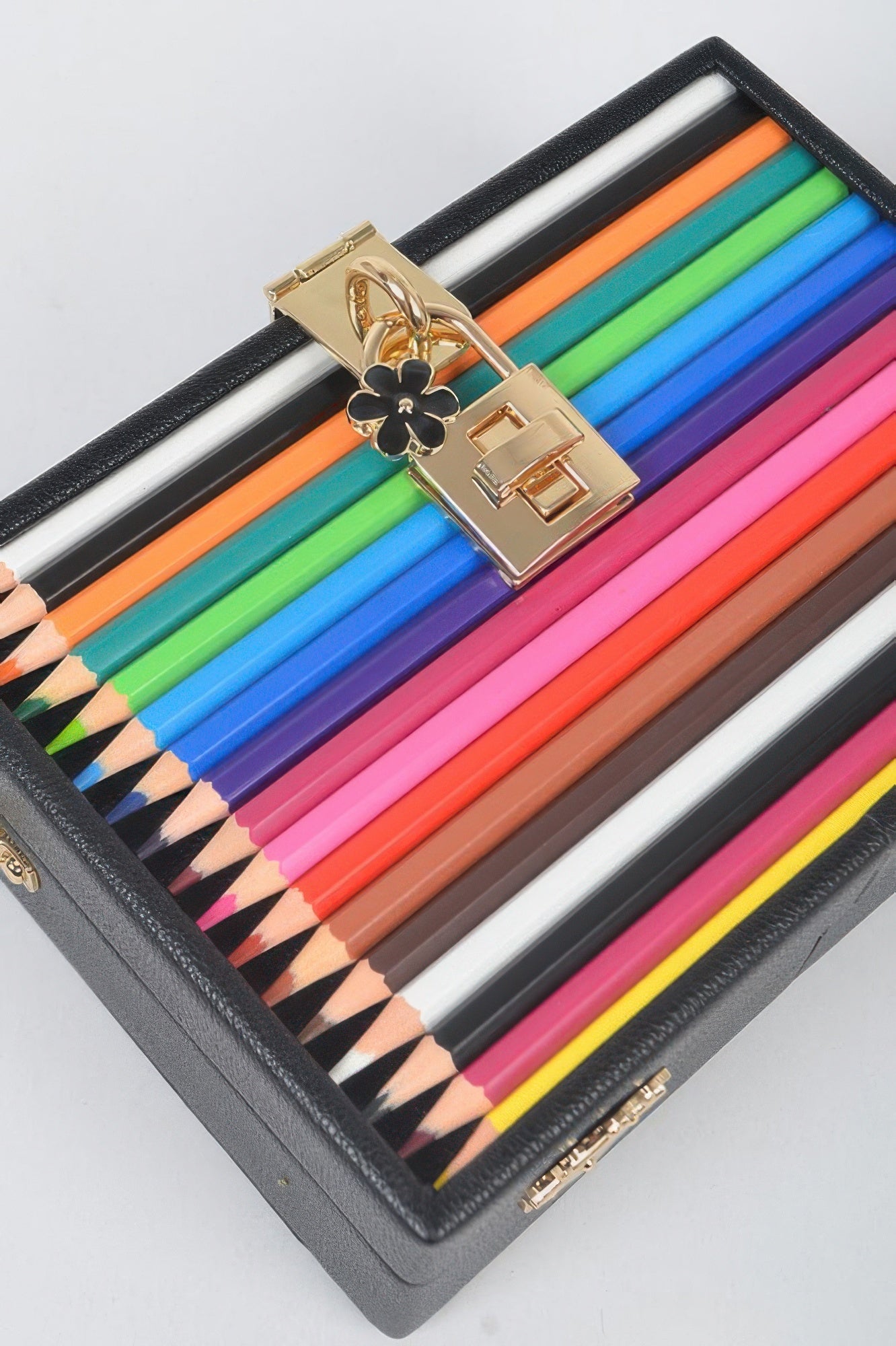 Clutch Handbag with gold flower clasp and striped colorful pencil design for artistic fashion