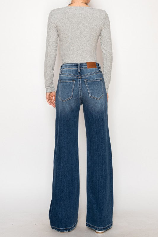 Artemis Vintage Relaxed Flared Jeans back view high waisted medium wash denim with back pockets and long flare