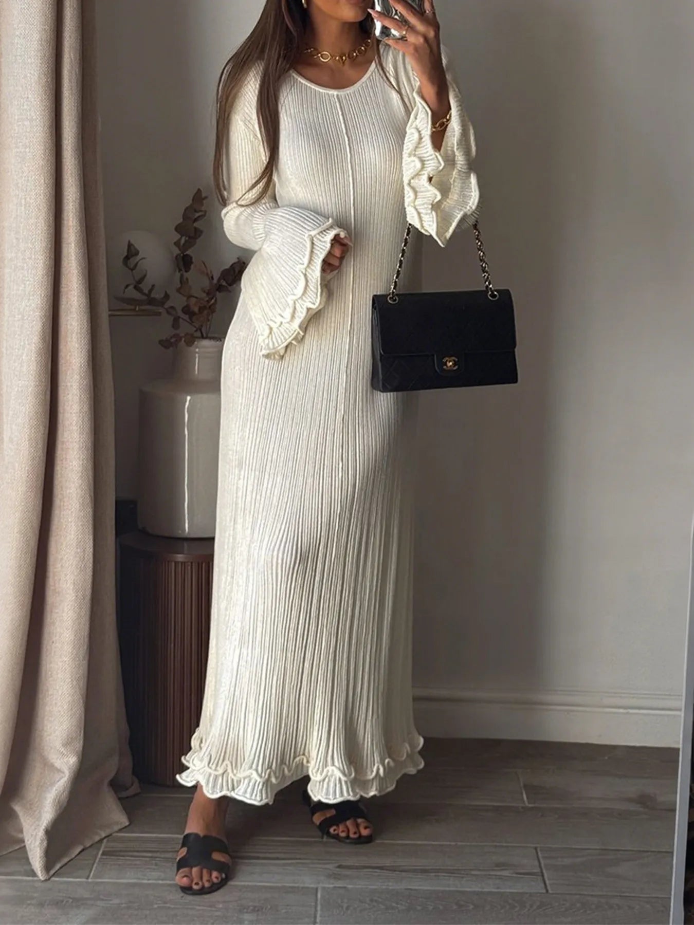 Trendsi cream ribbed knit midi dress for women with ruffled bell sleeves and ruffle hem styled with black shoulder bag