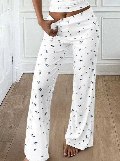 Trendsi white Wide Leg Pants Set with blue floral ditsy print and matching cropped top model holding waistband