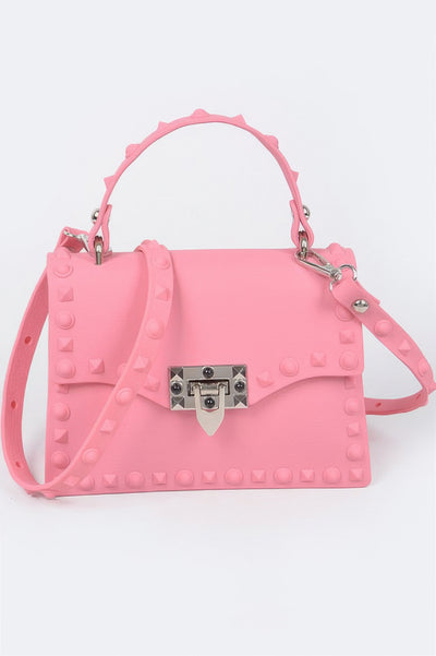 Monotone Studded Clutch in pastel pink with top handle adjustable shoulder strap and silver turn lock closure