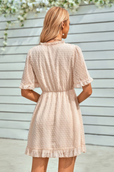 CCWHOLESALECLOTHING beige swiss dot ruffle midi dress back view with elastic waist and flutter sleeves
