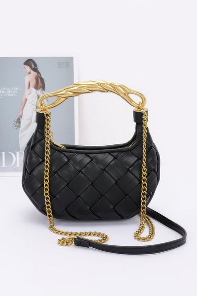 Black woven crossbody faux leather braided handle bag with gold chain strap and twisted top handle