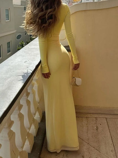 Trendsi Figure-Hugging Evening Dress long sleeve pastel yellow floor length gown back view with clutch