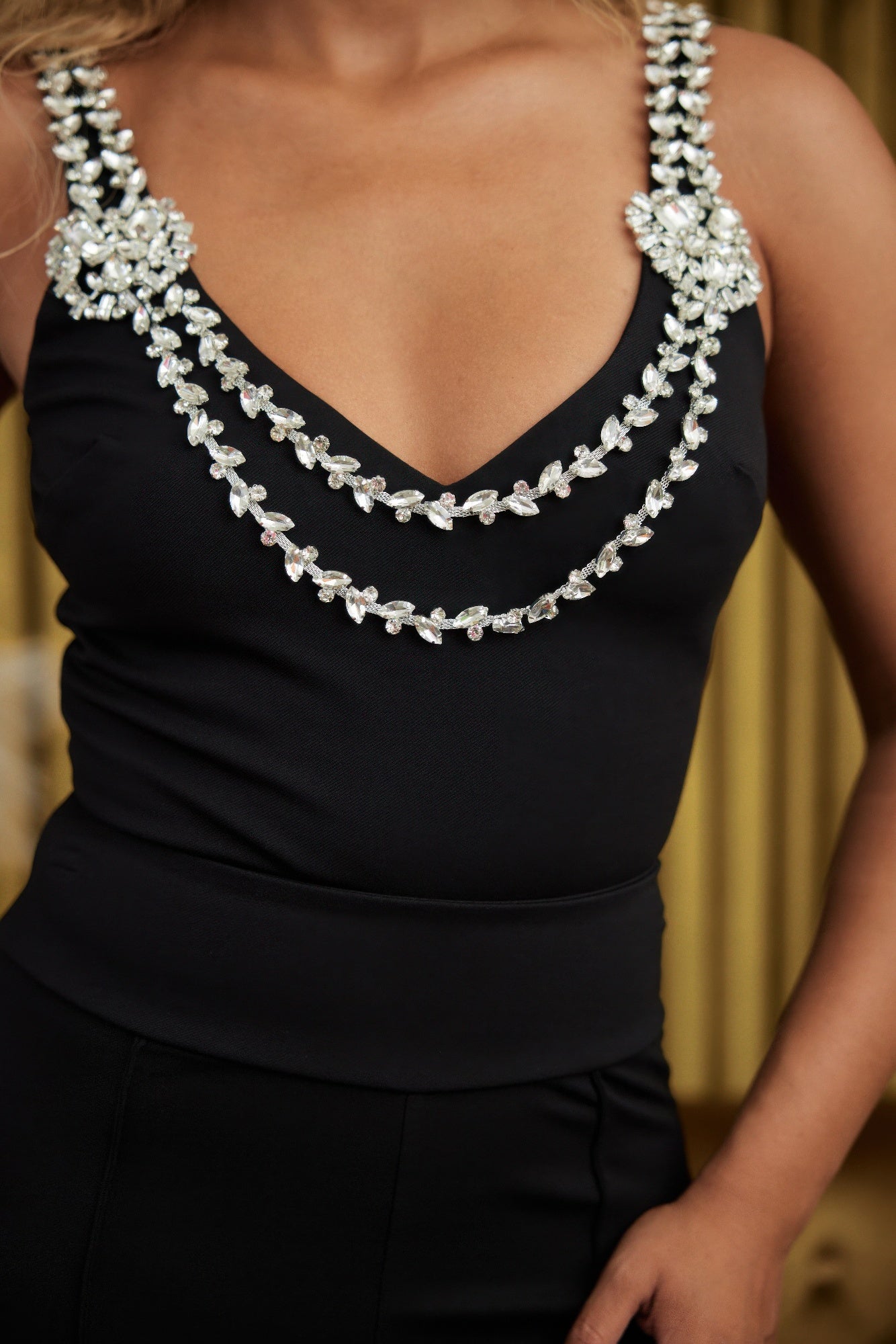 CCWHOLESALECLOTHING black V neck bodysuit with draped crystal chains for evening wear layered crystal strap bodysuit