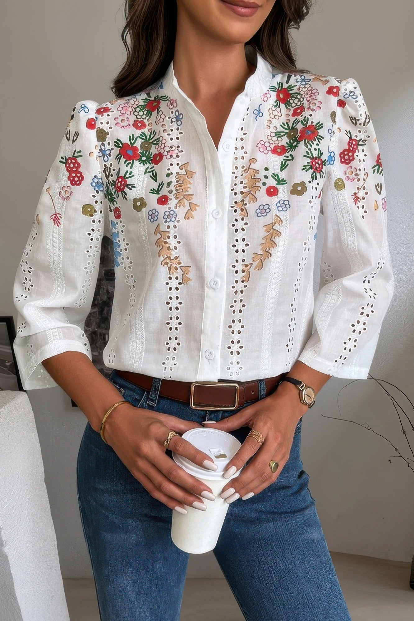 White embroidered eyelet Long Sleeve Blouse with colorful floral embroidery scallop collar and button front worn with jeans
