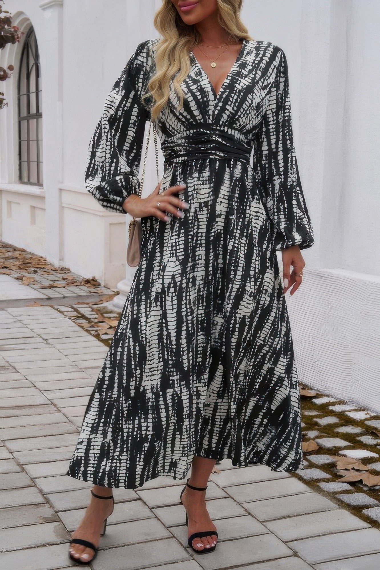 Black and white patterned V neck Tie Waist Fit Long Dress with long sleeves and ankle strap heels