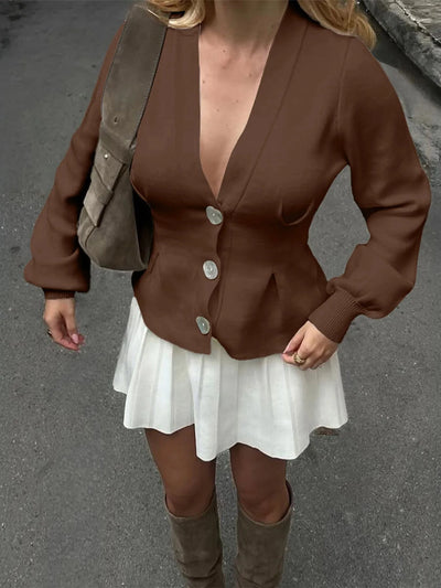 Trendsi women's button-up knit cardigan in brown with deep V neck and peplum fit paired with white skirt and boots