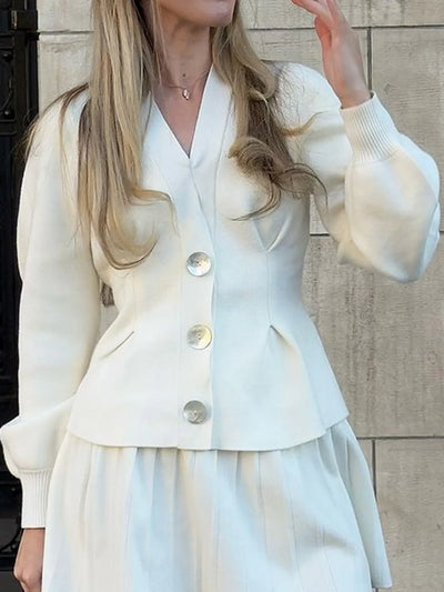 Trendsi white women's button-up knit cardigan with oversized buttons, puff sleeves and peplum hem styled with skirt