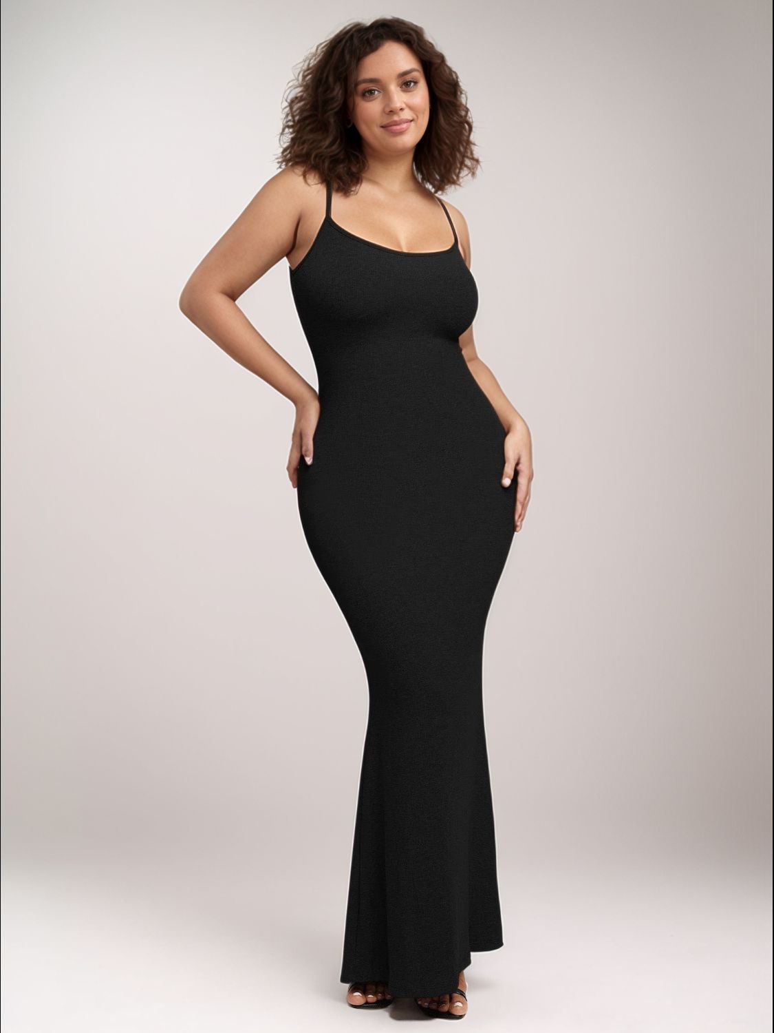 Trendsi sleeveless bodycon dress for women in black with thin straps and fitted silhouette