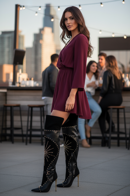 Black studded over-the-knee boots - brunette at rooftop bar