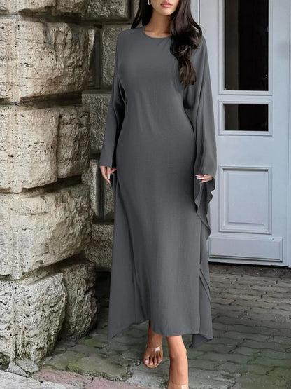 Trendsi gray bohemian maxi dress with cape sleeves on model ankle length relaxed fit round neck