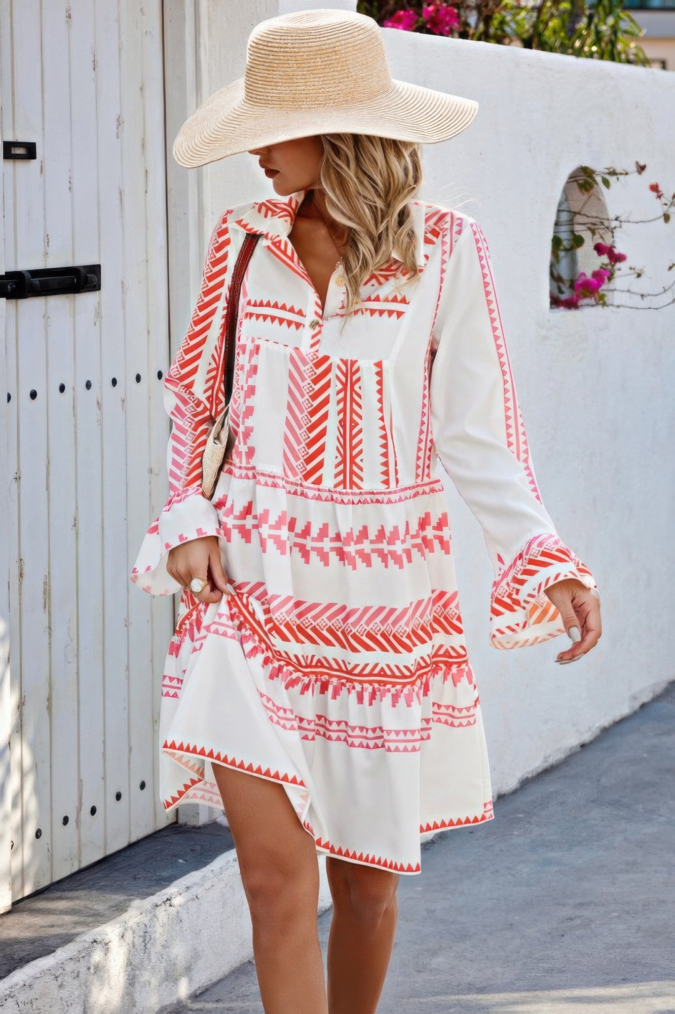 CCWHOLESALECLOTHING geometric print bell sleeve dress white and coral V neck tiered hem model wearing sun hat