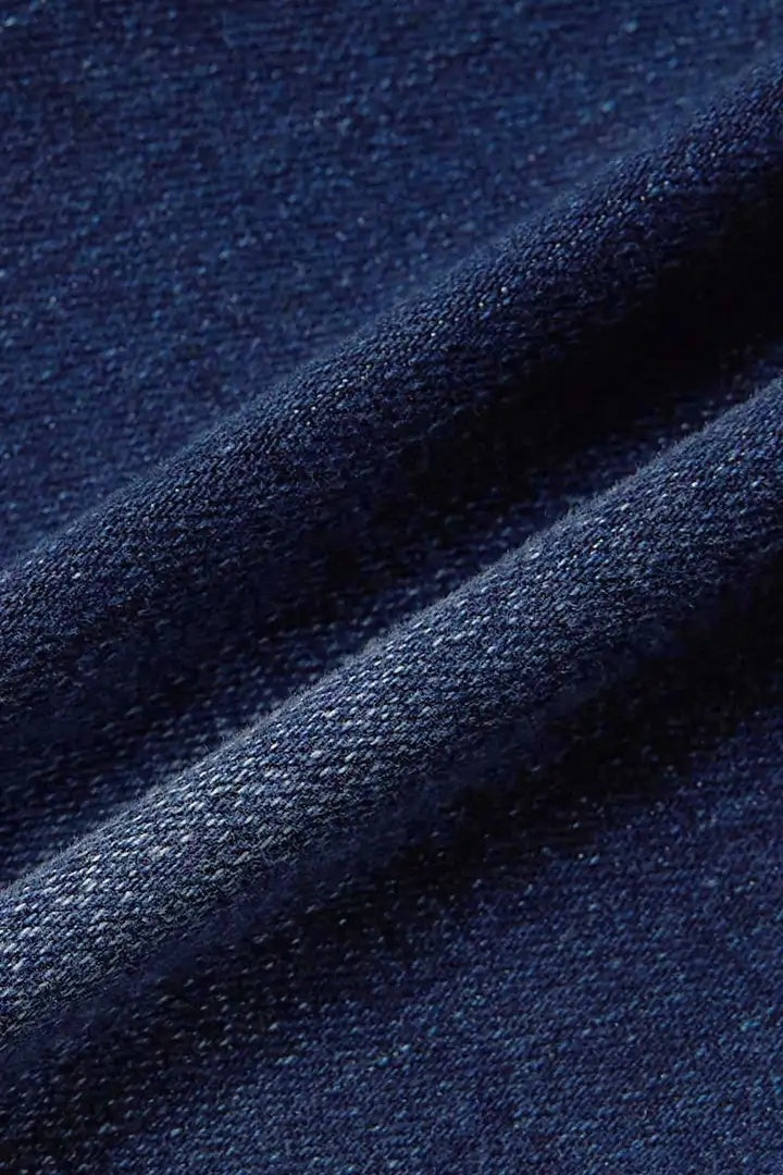 Trendsi close up of dark indigo denim fabric texture and drape for high waist wide leg embroidered jeans