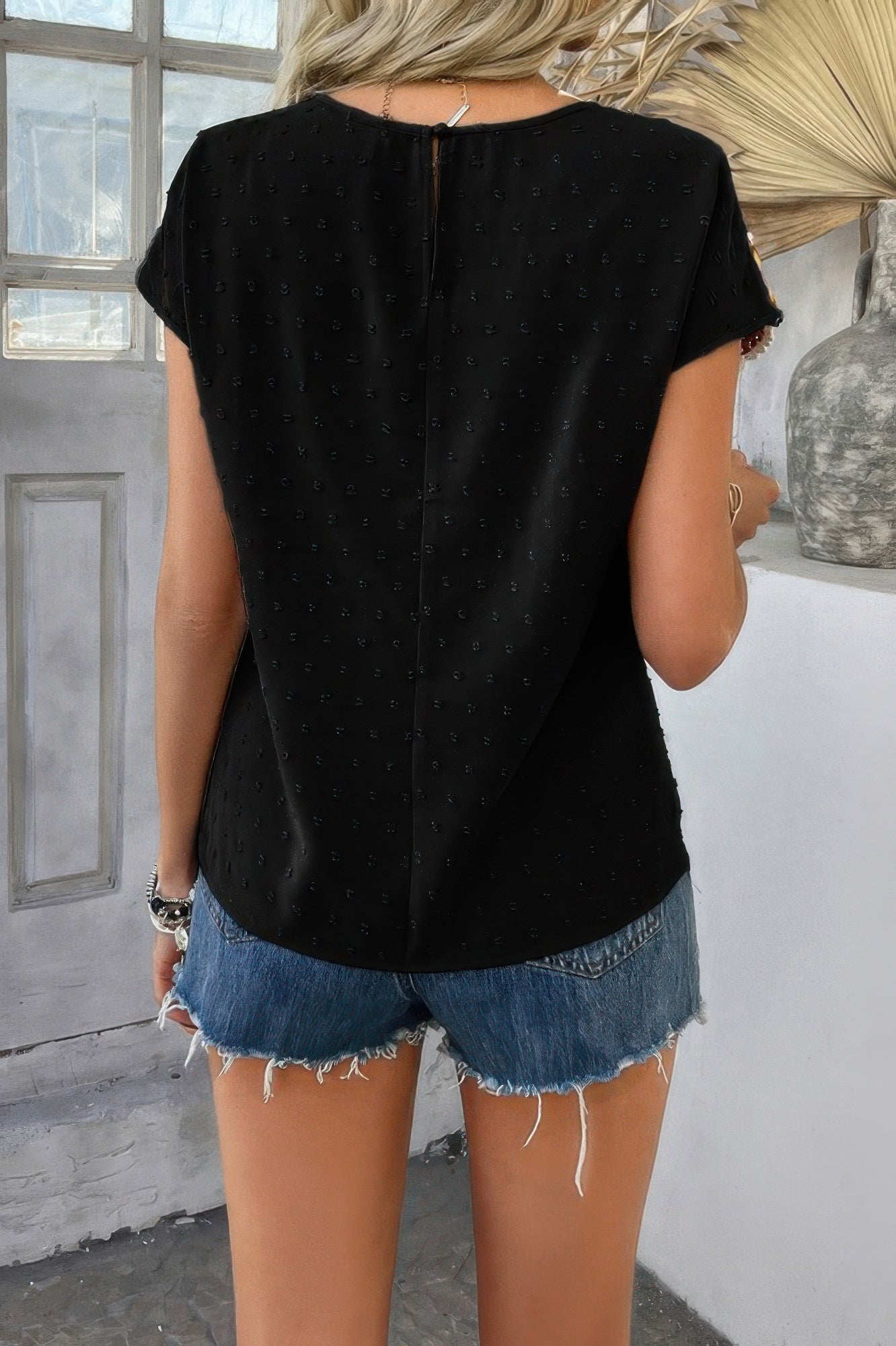 CCWHOLESALECLOTHING black Swiss dot crochet patchwork shirt back view on model with denim cutoff shorts